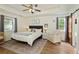 Serene bedroom with tray ceiling, and a bathroom at 7925 Silversmith Dr, Cumming, GA 30028