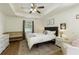 Serene bedroom with tray ceiling, and crib at 7925 Silversmith Dr, Cumming, GA 30028