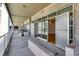 Exterior balcony view showcases a long porch with outdoor seating and multiple condo entrances at 890 Memorial Se Dr # 105, Atlanta, GA 30316