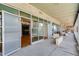 Wide angle of balcony leading to open glass doors to condo with concrete and glass accents at 890 Memorial Se Dr # 105, Atlanta, GA 30316