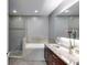 Modern bathroom featuring a tiled floor, granite countertops, and glass enclosed shower at 890 Memorial Se Dr # 105, Atlanta, GA 30316