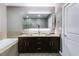 Bathroom featuring double vanity, granite countertops, and a large mirror at 890 Memorial Se Dr # 105, Atlanta, GA 30316