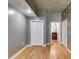 Neutral bedroom with hardwood floors and double door closet with view into hallway and kitchen at 890 Memorial Se Dr # 105, Atlanta, GA 30316