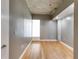 Bedroom with hardwood floors and an exposed concrete ceiling in a neutral color palette at 890 Memorial Se Dr # 105, Atlanta, GA 30316