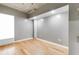 Bedroom with hardwood floors and an exposed concrete ceiling in a neutral color palette at 890 Memorial Se Dr # 105, Atlanta, GA 30316