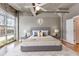 Bedroom featuring industrial ceilings, a wall of windows, and stylish contemporary furnishings at 890 Memorial Se Dr # 105, Atlanta, GA 30316