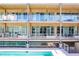 Contemporary building exterior featuring private balconies overlooking a sparkling community pool at 890 Memorial Se Dr # 105, Atlanta, GA 30316