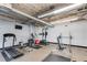 Bright and airy fitness center with workout equipment and exposed ceiling at 890 Memorial Se Dr # 105, Atlanta, GA 30316