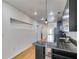 Galley kitchen featuring granite countertops, stainless steel appliances and sleek black cabinetry at 890 Memorial Se Dr # 105, Atlanta, GA 30316