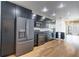 Modern kitchen with stainless steel appliances and sleek black cabinetry with granite countertops at 890 Memorial Se Dr # 105, Atlanta, GA 30316