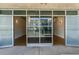 Wide angle of entry doors to condo interior featuring an open floorplan and hardwood flooring at 890 Memorial Se Dr # 105, Atlanta, GA 30316