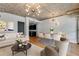 Bright living room features an open floor plan, hardwood floors, and exposed concrete ceiling at 890 Memorial Se Dr # 105, Atlanta, GA 30316