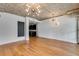 Spacious living area with hardwood floors and modern lighting, leading into the open concept kitchen at 890 Memorial Se Dr # 105, Atlanta, GA 30316