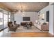 Cozy living room featuring neutral tones, exposed ceilings and access to a private balcony at 890 Memorial Se Dr # 105, Atlanta, GA 30316