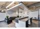 Comfortable lounge area featuring a granite bar, modern seating, and concrete floors at 890 Memorial Se Dr # 105, Atlanta, GA 30316