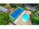 Aerial view showcasing the community pool and tennis court, offering residents recreational amenities at 907 Parkaire Xing, Marietta, GA 30068