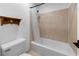 Bathroom featuring tiled shower and floors with a white toilet at 907 Parkaire Xing, Marietta, GA 30068