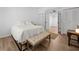 Comfortable bedroom with a plush bed, accent bench, and well-lit interiors at 907 Parkaire Xing, Marietta, GA 30068