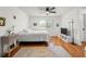 Bright bedroom featuring wood floors, a large window, and eclectic decor at 907 Parkaire Xing, Marietta, GA 30068