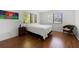 Inviting bedroom with light walls, wood floors, natural light, and window views at 907 Parkaire Xing, Marietta, GA 30068