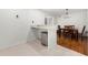 Dining area next to the kitchen has a bar countertop and a dark wood table at 907 Parkaire Xing, Marietta, GA 30068