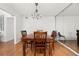 Dining room features wood table set, wood floors and mirrored wall at 907 Parkaire Xing, Marietta, GA 30068