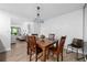 Relaxing dining room with wood table and chairs that flows into the living room at 907 Parkaire Xing, Marietta, GA 30068