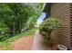 View of the building's exterior with lush greenery, offering a peaceful and private setting at 907 Parkaire Xing, Marietta, GA 30068