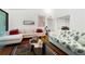 Bright living room features hardwood floors, white sofas, and tasteful decor at 907 Parkaire Xing, Marietta, GA 30068
