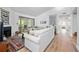 Bright living room features a fireplace, sliding glass doors, and modern decor at 907 Parkaire Xing, Marietta, GA 30068