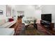 Bright living room features hardwood floors, white sofas and view to dining room at 907 Parkaire Xing, Marietta, GA 30068