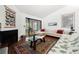 Bright living room features sliding glass doors to balcony, fireplace and hardwood floors at 907 Parkaire Xing, Marietta, GA 30068