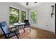 Sunroom with wood floors, large windows, and an outdoor view at 907 Parkaire Xing, Marietta, GA 30068