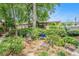 Building exterior with garden, seating area, and meticulously maintained landscaping at 100 Biscayne Nw Dr # A1, Atlanta, GA 30309