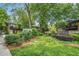 Charming brick building has lush landscaping with manicured shrubs and green lawn at 100 Biscayne Nw Dr # A1, Atlanta, GA 30309