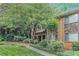 Inviting brick townhome with stone accents and lush landscaping, providing a serene and welcoming curb appeal at 100 Biscayne Nw Dr # A1, Atlanta, GA 30309