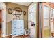 Hallway featuring a light blue dresser and ornate wall art at 100 Biscayne Nw Dr # A1, Atlanta, GA 30309