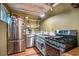 Functional kitchen with stainless steel appliances, open shelving, and a gas range for easy cooking and meal preparation at 100 Biscayne Nw Dr # A1, Atlanta, GA 30309