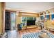 Bright living room with a large window, stylish decor, and hardwood floors, creating a welcoming atmosphere at 100 Biscayne Nw Dr # A1, Atlanta, GA 30309