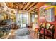 Eclectic living room featuring wood floors, a sliding glass door, and unique decor at 100 Biscayne Nw Dr # A1, Atlanta, GA 30309