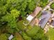 Aerial view of the property showcasing a well-maintained backyard, sunroom and lush greenery surrounding the house at 239 Kings Hwy, Decatur, GA 30030