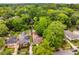 An aerial perspective of the home surrounded by trees, providing a sense of the property's setting and location at 239 Kings Hwy, Decatur, GA 30030