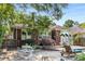 Backyard patio with dining set, lounge chair, and charming brick home at 239 Kings Hwy, Decatur, GA 30030