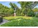 Spacious backyard with manicured lawn and storage shed at 239 Kings Hwy, Decatur, GA 30030