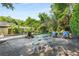 Backyard patio with dining set and lounge chairs overlooking the pool at 239 Kings Hwy, Decatur, GA 30030