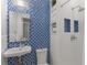Modern bathroom featuring blue mosaic tile backsplash and white fixtures at 239 Kings Hwy, Decatur, GA 30030