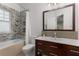 Modern bathroom with mosaic tile shower, vanity, and modern fixtures at 239 Kings Hwy, Decatur, GA 30030