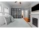 Comfortable bedroom featuring a decorative fireplace, bright windows, and ample storage at 239 Kings Hwy, Decatur, GA 30030