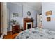 Bedroom with hardwood floors featuring a fireplace and warm, neutral-colored walls at 239 Kings Hwy, Decatur, GA 30030