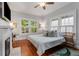 Cozy bedroom with hardwood floors, bright windows, and a decorative fireplace at 239 Kings Hwy, Decatur, GA 30030